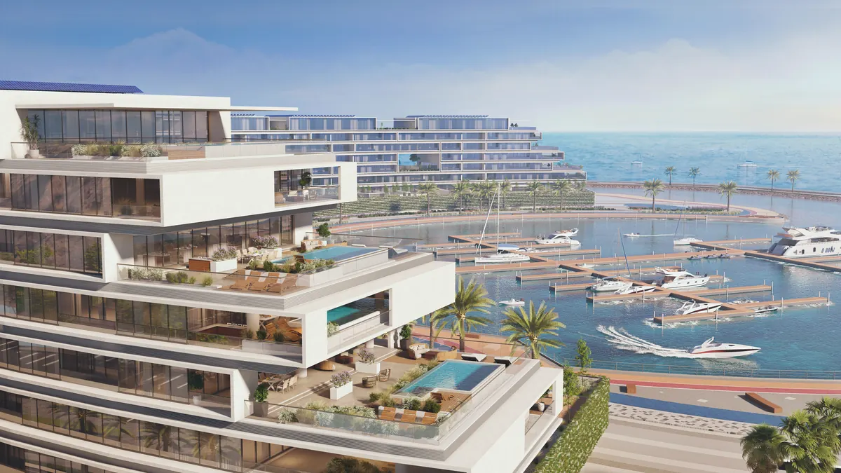 Aerial view of the sky terraces at The Arc, pools stepping down toward the marina